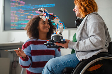 Two students showing classmates their science project.