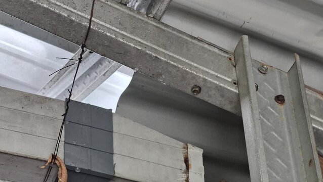 Rainwater seeps from a leaky roof.