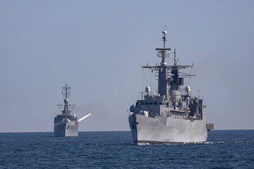 Military navy ships in sea war battle. © ValStock