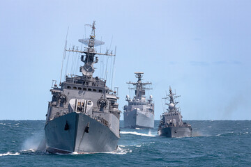 Fototapeta premium Formation of warships in the Black Sea during a peacekeeping operation. Тhree battleships in action.