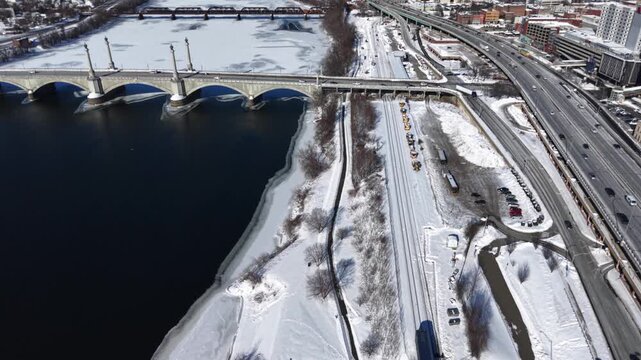 Aerial winter view of Springfield, MA river and bridge in snow