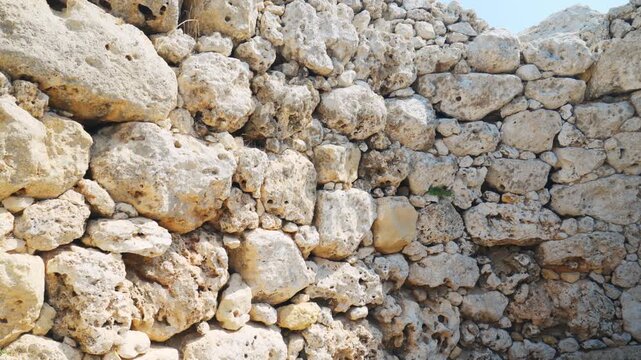 Close-up detail of ancient limestone stones at Ġgantija Temples, Gozo, Malta, showing prehistoric megalithic texture.