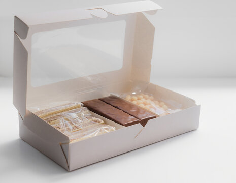 Snack gift, it contains wafers in plastic, chocolate bars, chiki in plastic.