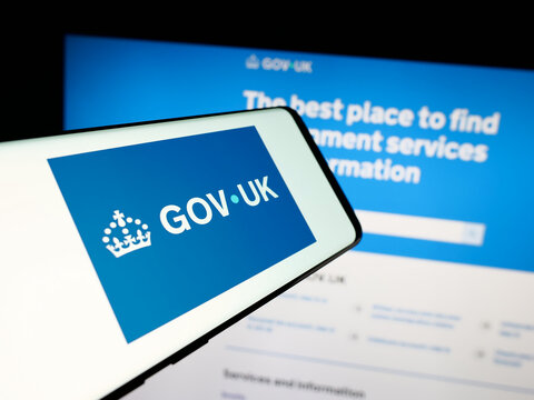 Stuttgart, Germany - 02-02-2026: Smartphone with logo of United Kingdom government website GOV.UK on screen in front of website. Focus on center-right of phone display.