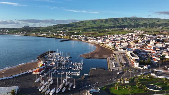Sunrise aerial over Praia da Vitoria marina and coastline on Terceira, Azores