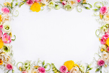 Bright roses and wildflowers create a cheerful floral border with clean white copy space, perfect for greetings, celebrations, branding, and seasonal design projects.