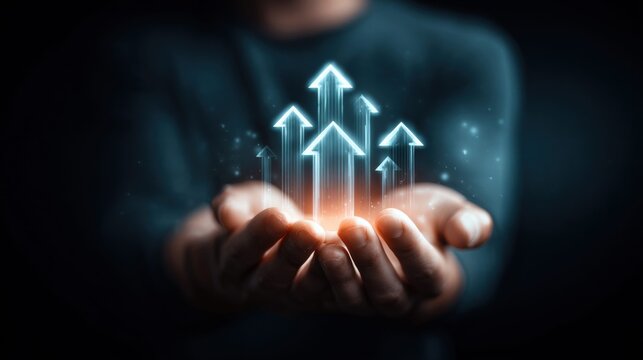 Glowing arrows held in hands represent business growth, symbolizing success, upward trends and goals.