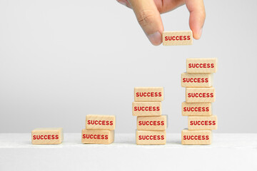 Business growth success process concepts, Hand of businessman arranging wooden blocks stacking as step stair