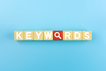 Keywords Concept. Keywords icons on wooden cubes.