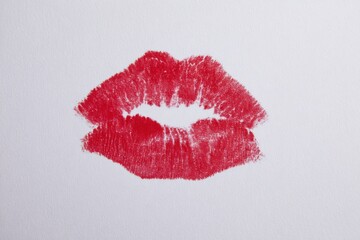 Fototapeta premium Red lipstick kiss mark on white background