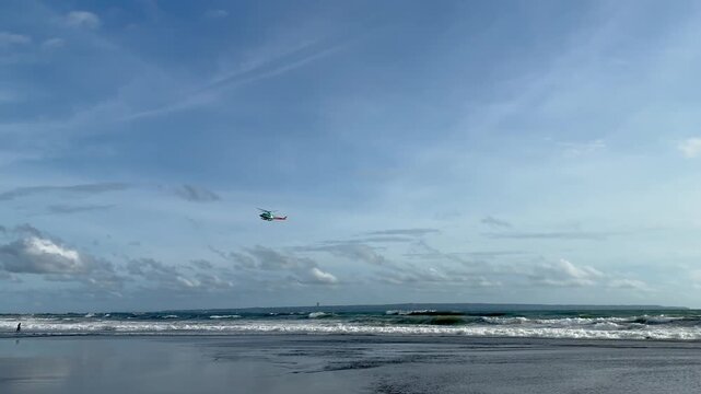 Helicopter flying above the sea rescue operation in the ocean