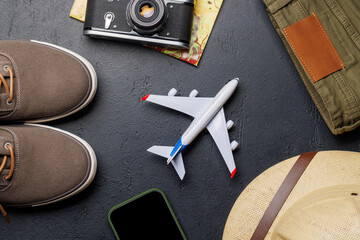 Safari clothing and gear on stone background