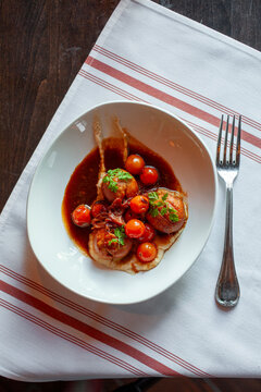 Overhead of upscale entree dish with round ingredients