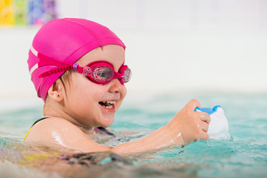 Fun baby swimming lesson for healthy lifestyle.