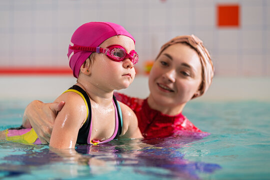 Early swimming education in an indoor pool.