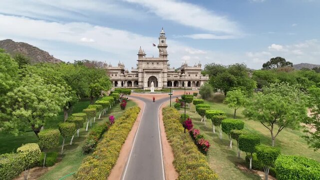 Mayo College heritage building, Mughal Garden, Lord Mayo statue and clock tower, Ajmer, Rajasthan, establishing drone shot