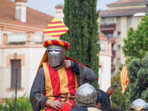 Medieval reenactment during the Guillem de Mont-rodon festival in Monzon, Huesca, Spain. Cultural event with Templars, historical clothing, and medieval atmosphere.