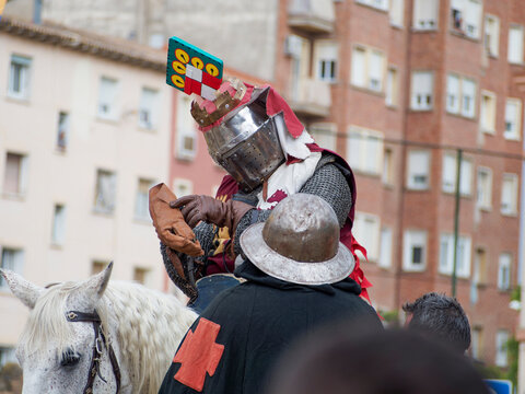 Medieval reenactment during the Guillem de Mont-rodon festival in Monzon, Huesca, Spain. Cultural event with Templars, historical clothing, and medieval atmosphere.