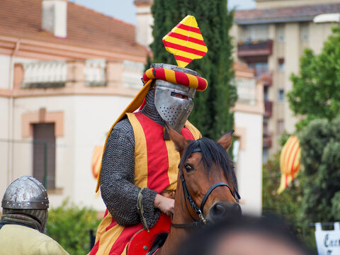 Medieval reenactment during the Guillem de Mont-rodon festival in Monzon, Huesca, Spain. Cultural event with Templars, historical clothing, and medieval atmosphere.
