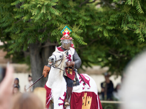 Medieval reenactment during the Guillem de Mont-rodon festival in Monzon, Huesca, Spain. Cultural event with Templars, historical clothing, and medieval atmosphere.