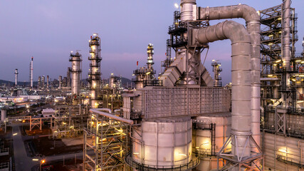 Aerial view oil and gas petrochemical storage tank with oil and gas refinery plant at twilight,...