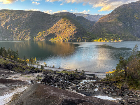 Scenic view from Langfossen waterfall toward fjord and mountain landscape