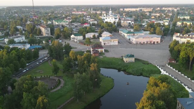 Drone flight over the central part of Uglich. Cityscape at dawn from above.