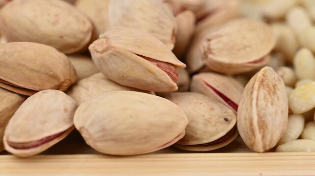 video of a mix of almonds, pistachios, cashews, and pine nuts