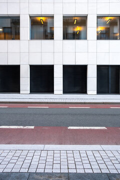 Modern office facade with windows on urban street in Oslo Norway during daylight showing clean architecture geometry and minimal city exterior