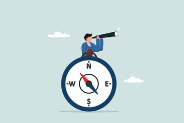 Business compass guidance direction or opportunity, make decision for business direction, finding investment opportunity, leadership or visionary concept, businessman with binocular and compass. © NASIH