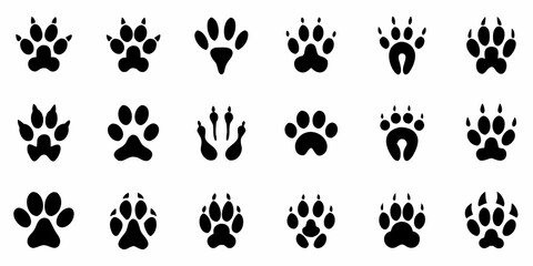 Fototapeta premium Collection of diverse animal footprints in a black and white arrangement