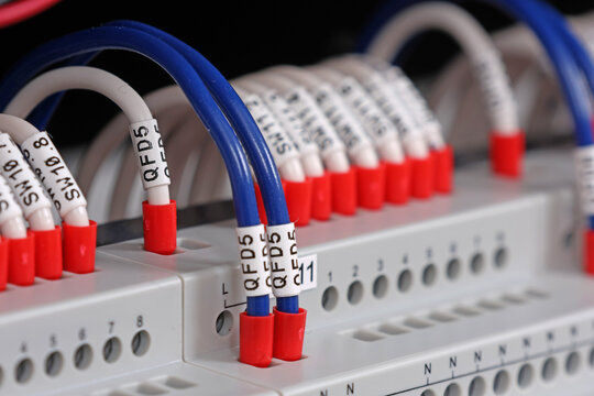 Marking electrical wiring wires with thermally printed nylon tape. 