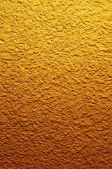 Fototapeta premium Elegant Gold Surface Texture with Radiant Shimmering Highlights for Stylish Designs and Decor.