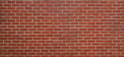 Obraz premium Red brick wall background creating solid masonry pattern