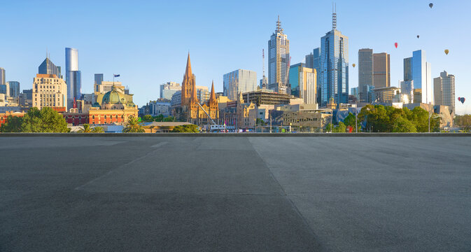 Melbourne city skyline with flying hot air balloons