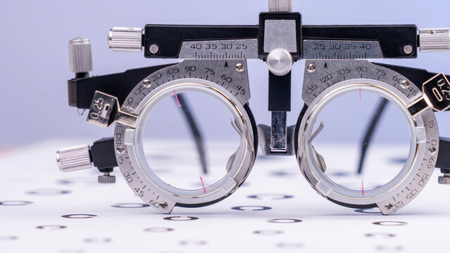 A trial frame, provided by an optometrist for the purpose of conducting an eye test. High quality photo