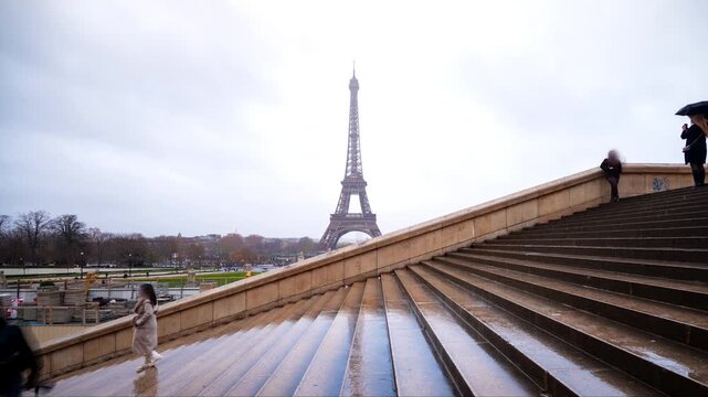 Timelapse of Eiffel Tower in Paris from Trocadero stairs on a rainy day