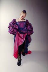 Young Girl in Purple Fantasy Gown and Combat Boots