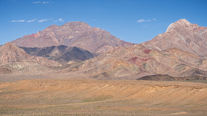 Obraz premium High altitude desert landscape with colorful mountains along Pamir Highway in summer, Murghab, Gorno-Badakhshan, Tajikistan