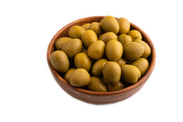 Fresh green olives in wooden bowl isolated on white. side view, close up