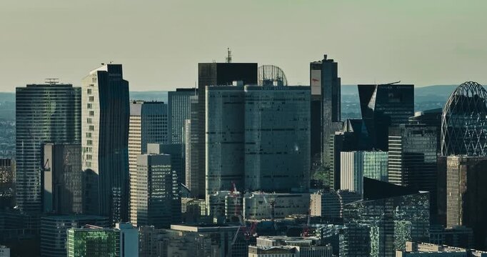 Business district buildings Paris, France. Aerial view of the office windows of a glass skyscrapers. Corporate company head quarter in urban environment. Architectural trends
