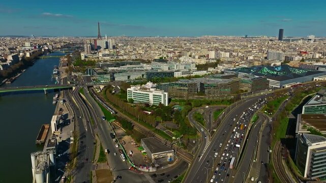 Aerial view of the most beautiful city of Paris in summer with the Seine River and the Eiffel Tower visible on the horizon