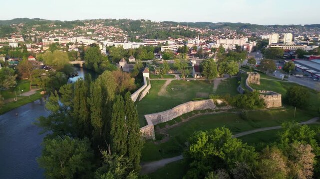 Aerial perspective of river Vrbas, flowing through the city of Banja Luka, Republic of Srpska, Bosnia and Herzegovina. Drone video.