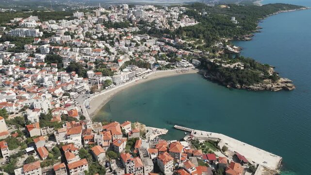Aerial perspective of Small beach in Ulcinj, Crna Gora. Flying backwards, drone video.