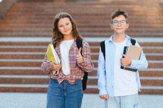 Schoolchildren standing outside campus ready for classes