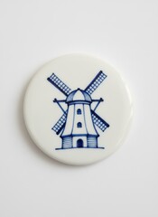 Obraz premium Porcelain plate with blue windmill design on white background