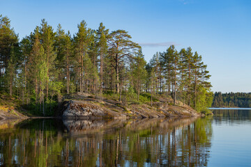 A sunny June evening at Koyonsaari island. Ladoga skerries. Karelia, Russia