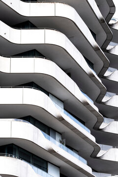 Curves and waves shape a modern residential architecture facade with balcony pattern in Hamburg Germany creating a sculptural urban rhythm