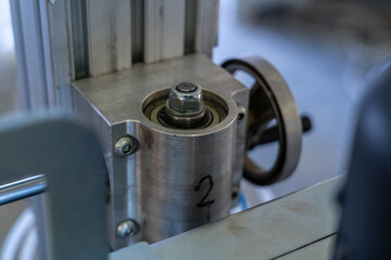 Naklejka premium Close-up of industrial bearing and handwheel adjustment mechanism labeled 2