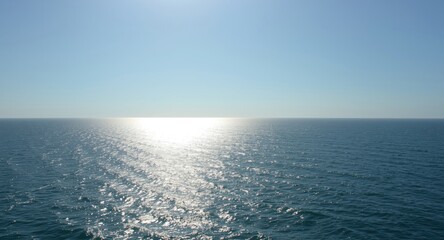 Fototapeta premium Bright sunny coastal scenes with sparkling ocean reflections